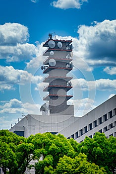 Telecommunications antenna tower for mobile phone with the blue sky background