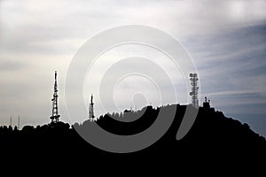 Telecommunications antennas on a hill