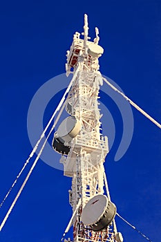 Telecommunications mast on a blue background