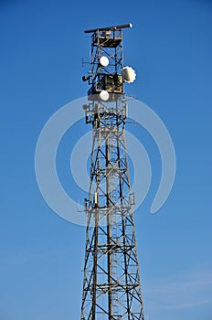 Telecommunications mast with blue sky