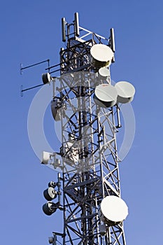 Telecommunications mast and blue sky