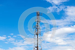 Telecommunications mast cloud sky.