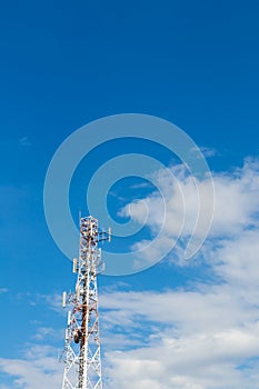 Telecommunications mast cloud sky.