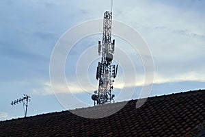 Telecommunications tower against blue sky