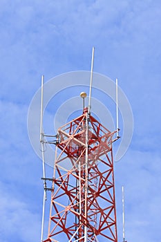 Telecommunications tower against blue sky