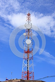 Telecommunications tower against blue sky