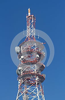Telecommunications tower against a blue sky