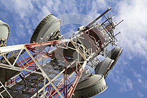 Telecommunications tower against blue sky