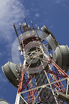 Telecommunications tower against blue sky