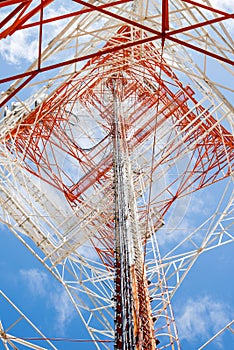 Telecommunications tower with clear blue sky