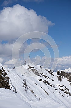 Telecommunications tower with cloudy sky in the