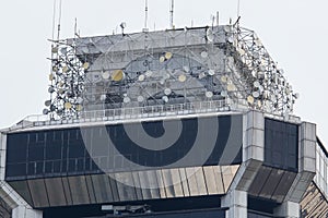 Telecommunications tower with many satellite transmitters