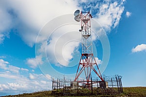 Telecommunications tower and satellite dish telecom network in mountains