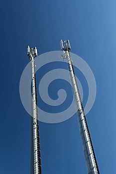 Telecommunications towers with blue sky