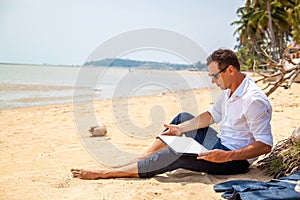 Telecommuting, businessman relaxing on the beach with laptop and palm, freelancer workplace, dream job.