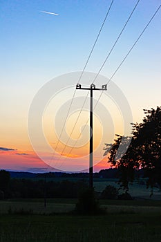 telegraph pole at colorful sunset