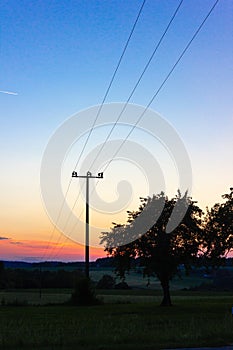 telegraph pole at colorful sunset