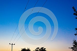 telegraph pole at colorful sunset