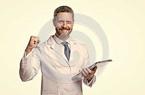 Telehealth doctor make winning geture. Happy man doctor using laptop isolated on white. Ehealth