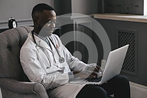 Telehealth with virtual doctor appointment and online therapy session. Black doctor online conference photo