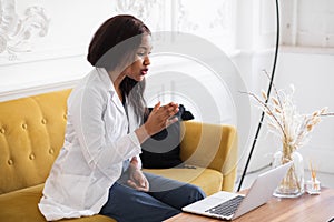 telehealth with virtual female doctor appointment and online therapy session. Black female doctor online conference photo