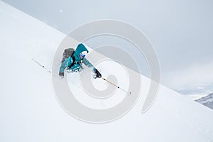 Telemark skier in deep soft powder in Northern Japan. Backcountry skiing near Niseko Mountain photo