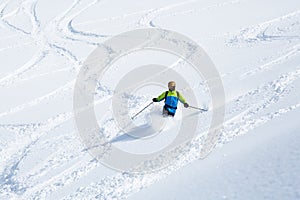 Telemark skiing on powder slope with few ski tracks in Hokkaido photo