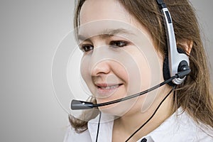 Telemarketing and customer service concept. Young smiling woman