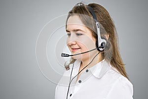 Telemarketing and customer service concept. Young smiling woman - operator.