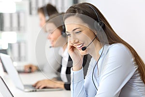 Telemarketing operator working at office photo