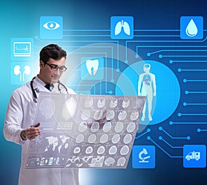 Telemedicine concept with doctor looking at x-ray image