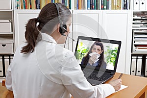 Telemedicine concept: doctor or pharmacist during a video consult with a patient with a virus infection.