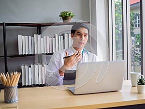 Telemedicine Coronavirus concept. Doctor working with mobile phone and stethoscope and digital tablet laptop in modern office at