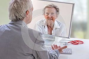 Telemedicine or telehealth concept, Doctor on the computer laptop screen and patient conferencing on treatment