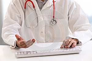 Telemedicine or telehealth concept, Doctor with a stethoscope on the computer laptop screen