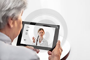 Telemedicine or Telehealth with a Doctor and a senior woman with