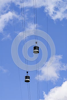 Telepherique or Aerial Tramway, aerial lift in the Alps against blue sky, France, Europe photo