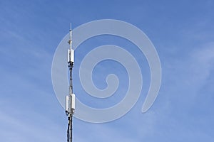 Telephone antenna on blue sky
