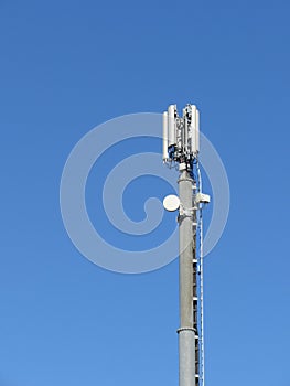 Telephone antenna on blue sky background