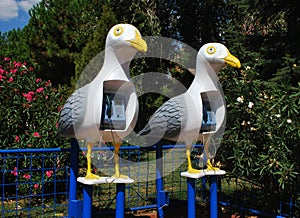 Telephone booths in the form of seagulls.