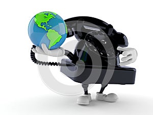 Telephone character holding world globe