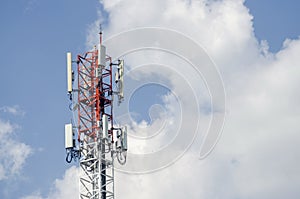 Telephone and Internet transmission towers on sky and cloud background