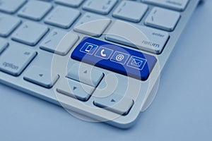 Telephone, mobile phone, at and email icon on modern computer