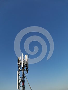 Telephone pole in blue sky background