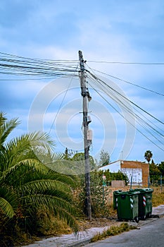 Telephone pole overloaded with cables