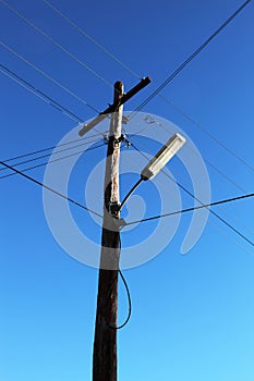 Telephone pole with wires and lamp