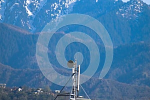 Telephone and satellite antennas on the roof of the building, 4G 5G cell tower photo