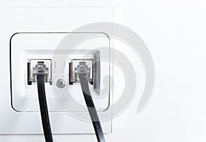 Telephone socket and telephone cable on the wall