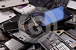 Telephones and smartphones of various types and generations not suitable for repair. Electronic scrap