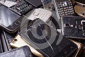 Telephones and smartphones of various types and generations not suitable for repair. Electronic scrap